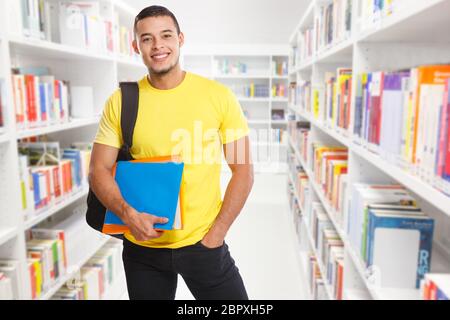 Student young man portrait library learning smiling people learn Stock Photo