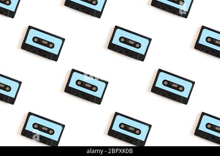 Cassette tapes pattern on a white background. Creative layout. Stock Photo