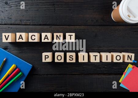 Words VACANT POSITION on a wooden blocks. Human Resources and personnel hiring concept Stock Photo