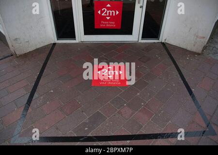 A 2m social distancing area marked out outside a bank in Merthyr Tydfil, Wales, UK. Stock Photo
