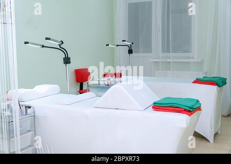 Orthopedic pillows with a memory effect on the couches in the office of the lashmakers. Lashmaker workplace Stock Photo