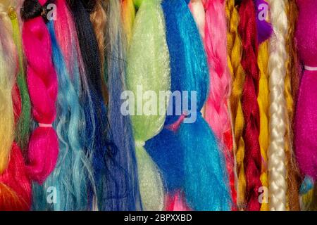 full frame abstract background showing lots of colorful hair extensions Stock Photo