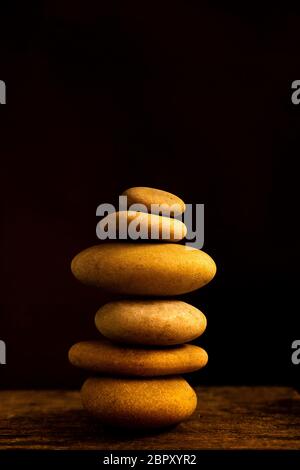 Pile of pebbles on a black background Stock Photo