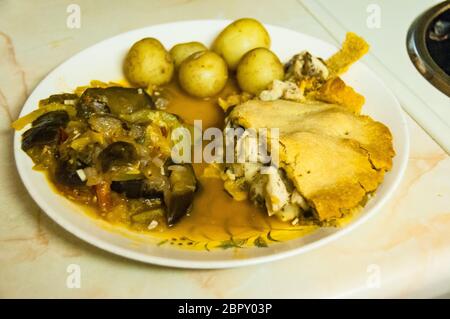 A home baked chicken and mushroom pie with ratatouille Stock Photo