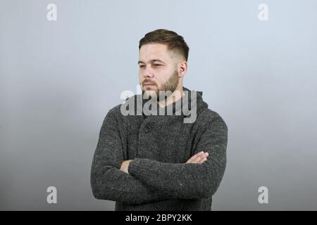 Upset Male Hands Crossed And Makes A Grimace On Face. People Who Are Offended Stock Photo