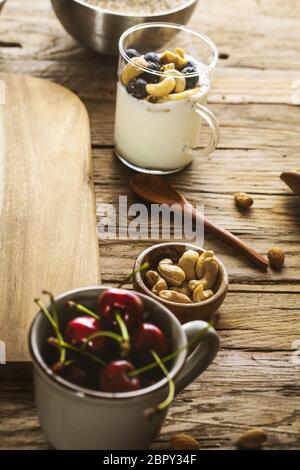 Healthy breakfast variety. Cereals with fruit. Yogurt with seeds. Fresh fruit Stock Photo