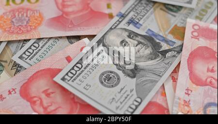 Counting Rmb Counting with chinese RMB and USD banknote Stock Photo - Alamy