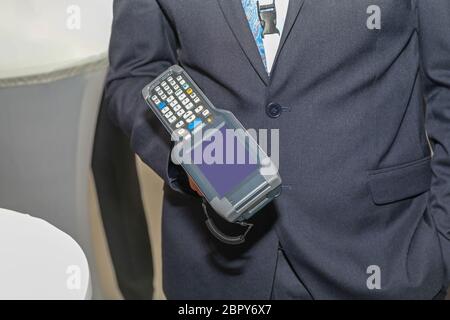 Man Holding Handheld Barcode Scanner Reader Portable Computer Stock Photo