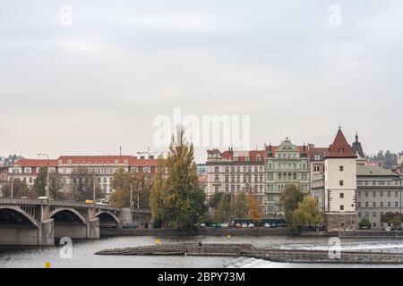Jirasek bridge, also called Jiraskuv Most, in Prague, Czech Republic, over the Vltava river, with a view of the Smichov and Andel districts, in the ci Stock Photo