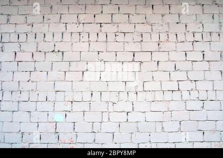 White wall of white dirty cement blocks. Empty horizontal building texture background, copy space for text Stock Photo