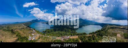 Panoramic aerial view of beautiful twin lakes in an ancient volcanic caldera (Lakes Buyan and Tamblingan, Bali, Indonesia) Stock Photo