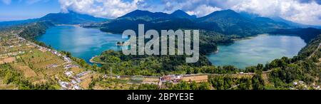 Panoramic aerial view of beautiful twin lakes in an ancient volcanic caldera (Lakes Buyan and Tamblingan, Bali, Indonesia) Stock Photo