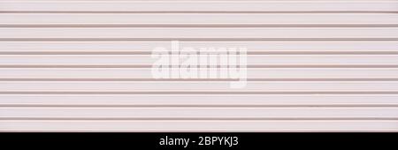 Abstract white pink brick wall texture background. Horizontal panoramic view of masonry brick wall for interior design. Stock Photo