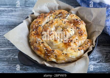 Vertuta, traditional Romanian, Moldavian or Balkan baking pie. Spiral filo pastry pie. Stock Photo