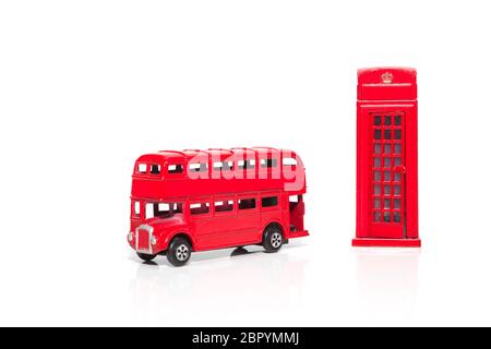 London souvenirs, red telephone booth, double-decker buses popular city symbols. Isolated on white background Stock Photo