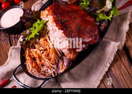 delicious pulled pork with baked potato quarters Stock Photo
