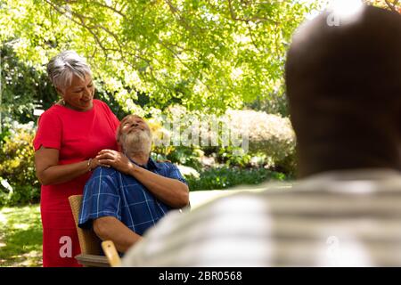 Senior couple embracing each other in the garden Stock Photo