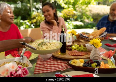 Family eating together at table Stock Photo