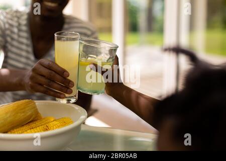 Family eating together at table Stock Photo