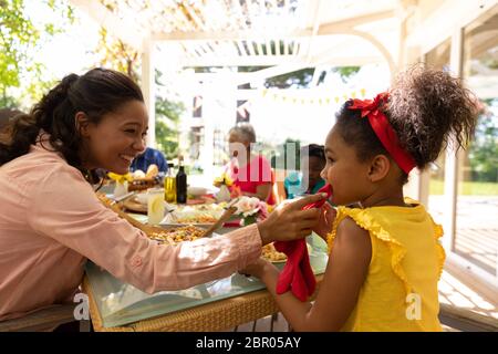 Family eating together at table Stock Photo