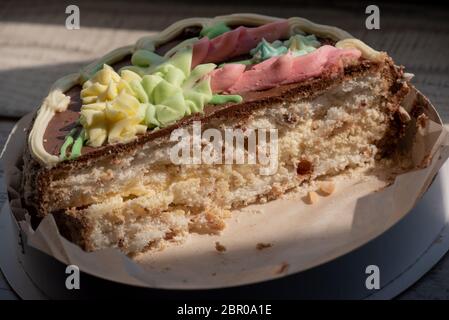 delicious and mouth watering white chocolate icing cake, nuts and crispy meringue, Kiev cake Stock Photo