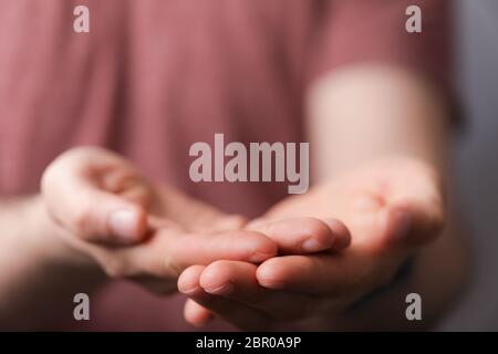 A man holding empty his hand Stock Photo