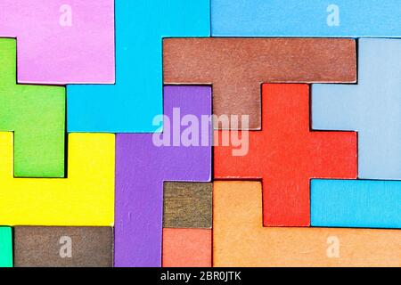 top view of assembled puzzle from colored wooden pentominoes and blocks Stock Photo