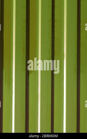 Diagonal pattern of metal profile. Fences from the galvanized iron painted by a polymeric covering. Stock Photo