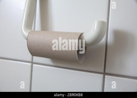 Close-up Of Finished Toilet Paper Roll In Bathroom Stock Photo