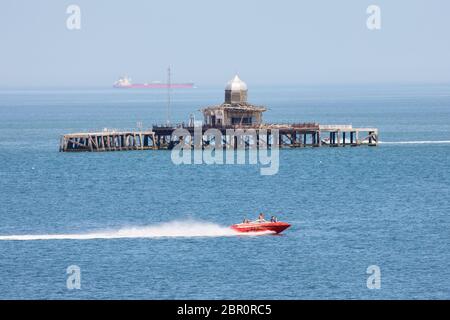Herne Bay, Kent, UK. 20th May 2020: UK Weather. A hot sunny day brings out people for all forms of watersports on a glorious hot, calm day near the abandoned old pier head. Credit: Alan Payton/Alamy Live News Stock Photo