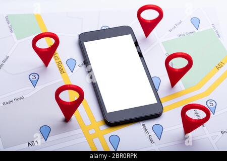 An Overhead View Of Map With Red Location Marker And Blank Display Mobile Phone Stock Photo
