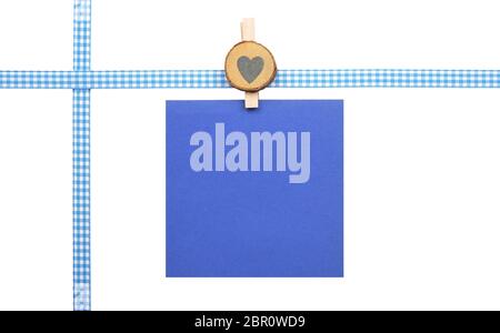 Checked ribbon and paper on white background Stock Photo