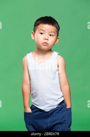 Little kid putting hand in jeans Stock Photo