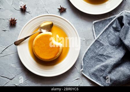 Small homemade sweet caramel pudding close up