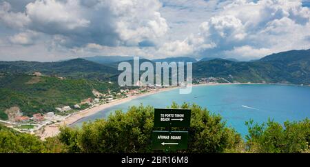 Tourist directional signs,Porto Timoni beach,Afionas Square,with Agios Georgios Beach in the background,Corfu,Greece,Ionian Islands Stock Photo