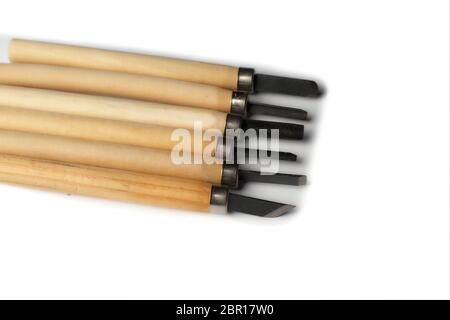 Wood carving tools isolated on a white background. Set of various cuts. Stock Photo