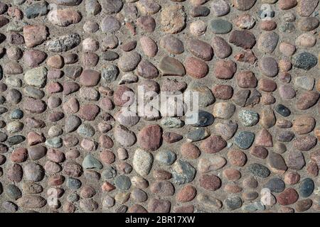 Stone pavement texture background. Cobblestone background. Stone pavement texture. Stock Photo