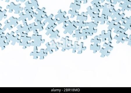 Light blue texture puzzle pieces separate white background Stock Photo