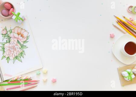 sketch drawing with colored pencils. flowers peonies. Candles, gifts, tea and white background Stock Photo