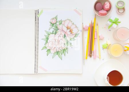 sketch drawing with colored pencils. flowers peonies. Candles, gifts, tea and white background Stock Photo