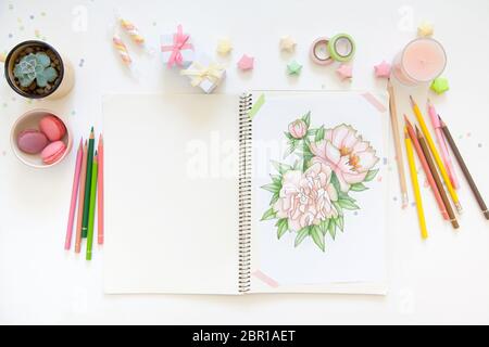 sketch drawing with colored pencils. flowers peonies. Candles, gifts, tea and white background Stock Photo