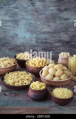 Various types of pasta on the white background Stock Photo