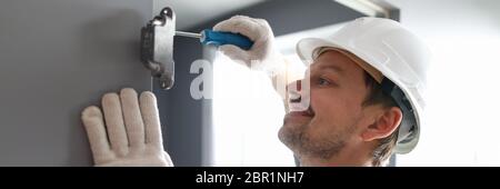 Cheerful male in white helmet Stock Photo