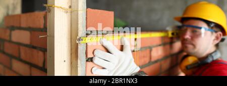 Builder using special tools Stock Photo