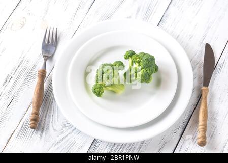 Fresh broccoli on the white plate Stock Photo
