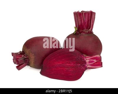 Whole red beetroots and a half isolated on white background Stock Photo