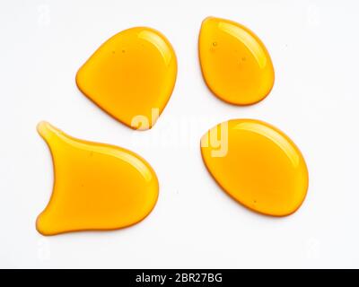 Honey drops. Honey for design elements. Abstract pattern from honey drops. Isolated on white with clipping path. Can use for design or text. Stock Photo