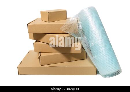 pile of various size boxes and bubble packing material Stock Photo