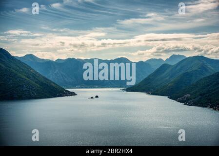 Panoramic View of the Bay of Kotor with The small islands of Ostrvo and Sveti Juraj monastery , Montenegro Stock Photo