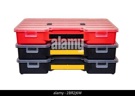Equipment of craftsman. Three professional plastic storage boxes for screws, bolts, dowels and some other components isolated on a white background. H Stock Photo